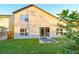 An expansive lawn in the backyard with a patio area, ideal for outdoor entertaining at 2110 Korat Ln, Maitland, FL 32751