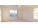 Neutral bedroom bathed in light from two windows, featuring plush carpet and ample closet space at 2110 Korat Ln, Maitland, FL 32751