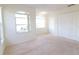 Neutral bedroom featuring plush carpet, a ceiling fan, and large windows providing lots of natural light at 2110 Korat Ln, Maitland, FL 32751