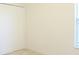 A neutral carpeted bedroom with a window and closet at 2110 Korat Ln, Maitland, FL 32751