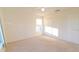 Bright bedroom featuring neutral carpet, ceiling fan, window, and a closet for storage at 2110 Korat Ln, Maitland, FL 32751