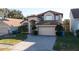 Inviting two-story home with a spacious two-car garage and a well-kept front yard at 2110 Korat Ln, Maitland, FL 32751