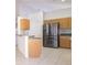 Modern kitchen featuring stainless steel appliances, an island with bar seating, and plenty of counter space at 2110 Korat Ln, Maitland, FL 32751