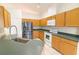 The kitchen has ample cabinet space, stainless steel appliances, and a large sink at 2110 Korat Ln, Maitland, FL 32751