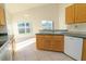 Functional kitchen with updated appliances, countertop seating, and lots of natural light at 2110 Korat Ln, Maitland, FL 32751