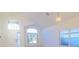 Bright living room featuring large windows and modern lighting fixtures at 2110 Korat Ln, Maitland, FL 32751
