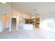 Open-concept living space features a staircase, tile, carpet, and connects to the kitchen at 2110 Korat Ln, Maitland, FL 32751