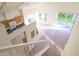 Open-concept living space with kitchen, dining, and living areas, featuring lots of natural light and neutral carpeting at 2110 Korat Ln, Maitland, FL 32751