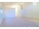 Spacious living room with carpet, vaulted ceilings, and a view of the staircase at 2110 Korat Ln, Maitland, FL 32751