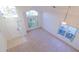 Bright, open living room with vaulted ceilings, large windows, and neutral carpet, creating an inviting atmosphere at 2110 Korat Ln, Maitland, FL 32751