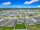 Aerial view of a residential neighborhood with houses and green lawns, showcasing the community layout and location at 2279 Raven Ridge Road, Minneola, FL 34715