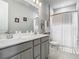 Bright bathroom with double sinks and a shower/tub combo at 2279 Raven Ridge Road, Minneola, FL 34715