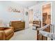 Well-organized Bedroom showcases a crib, changing table, and closet at 2279 Raven Ridge Road, Minneola, FL 34715