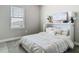 Neutral bedroom showcasing a Murphy bed and natural light from a window at 2279 Raven Ridge Road, Minneola, FL 34715