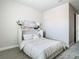 Comfortable bedroom featuring a Murphy bed and soft neutral decor at 2279 Raven Ridge Road, Minneola, FL 34715