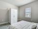 Inviting bedroom with a space-saving Murphy bed and ample natural light at 2279 Raven Ridge Road, Minneola, FL 34715