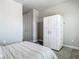 This spare bedroom features neutral walls, and a Murphy bed, and access to a closet at 2279 Raven Ridge Road, Minneola, FL 34715