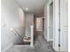 Upstairs hallway with carpet and white doors that provide access to multiple rooms at 2279 Raven Ridge Road, Minneola, FL 34715