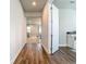 Inviting hallway showcases wood flooring and provides a glimpse into the adjacent living spaces at 2279 Raven Ridge Road, Minneola, FL 34715