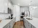 Bright kitchen view with stainless steel appliances, kitchen island and backsplash at 2279 Raven Ridge Road, Minneola, FL 34715