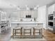 Bright kitchen featuring a quartz island, pendant lighting, and stainless steel appliances at 2279 Raven Ridge Road, Minneola, FL 34715