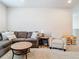 Cozy seating area with a comfortable sofa, armchair, and a coffee table on carpet at 2279 Raven Ridge Road, Minneola, FL 34715