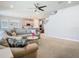 Open concept living room with kitchen view, a comfortable sofa, and a spacious, inviting atmosphere at 2279 Raven Ridge Road, Minneola, FL 34715