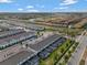 Expansive aerial view showcasing the townhome community layout and surrounding neighborhood at 2408 Dubai St, Kissimmee, FL 34747