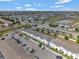 A high, scenic aerial view showcasing the community's layout, with a pond and surrounding landscape at 2408 Dubai St, Kissimmee, FL 34747