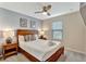 Inviting bedroom with natural light, ceiling fan, and decorative wall art at 2408 Dubai St, Kissimmee, FL 34747