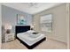 Bedroom with marine decor and stylish lamps and neutral carpet at 2408 Dubai St, Kissimmee, FL 34747