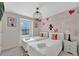 Cute decorated bedroom with two twin beds and overhead chandelier at 2408 Dubai St, Kissimmee, FL 34747