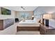 Spacious bedroom with mounted television, gray walls, and ceiling fan at 2408 Dubai St, Kissimmee, FL 34747