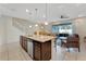 Spacious kitchen island opens to the living room and screened patio, perfect for entertaining at 2408 Dubai St, Kissimmee, FL 34747