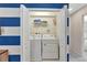 Laundry closet featuring a stacked washer and dryer at 2408 Dubai St, Kissimmee, FL 34747