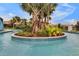 Relaxing lazy river with lush landscaping and palm trees, perfect for a serene float at 2408 Dubai St, Kissimmee, FL 34747