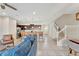 Bright and airy living space with tile flooring and an open staircase at 2408 Dubai St, Kissimmee, FL 34747