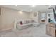 Comfortable loft area with plush carpeting, ample seating, and plenty of natural light at 2408 Dubai St, Kissimmee, FL 34747