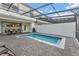 Relaxing backyard featuring a private pool, patio, and covered dining area perfect for outdoor entertaining at 2408 Dubai St, Kissimmee, FL 34747