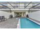Inviting backyard with a refreshing pool, a grilling station and an outdoor dining space for entertaining at 2408 Dubai St, Kissimmee, FL 34747