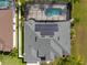 Aerial view of the home's roof with solar panels, pool, and surrounding yard at 3037 Diamond Ln, St Cloud, FL 34772