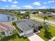 Beautiful single-story home with a screened lanai next to a pond in a lushly landscaped neighborhood at 3037 Diamond Ln, St Cloud, FL 34772