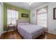 Bedroom with hardwood floors and large windows providing natural light at 3037 Diamond Ln, St Cloud, FL 34772