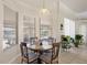 Sunlit breakfast nook features lots of light, a view to the water, and seating for four at 3037 Diamond Ln, St Cloud, FL 34772