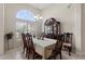 Elegant dining room featuring a china cabinet and table set for six guests at 3037 Diamond Ln, St Cloud, FL 34772