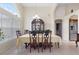 Elegant dining room featuring an ornate china cabinet and stylish chairs at 3037 Diamond Ln, St Cloud, FL 34772