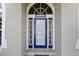 Close-up of the home's front door with decorative tile accents at 3037 Diamond Ln, St Cloud, FL 34772