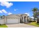 Charming home with a well-manicured lawn, two-car garage, and beautiful landscaping at 3037 Diamond Ln, St Cloud, FL 34772
