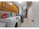 Laundry room featuring washer, dryer, and ample cabinet storage at 3037 Diamond Ln, St Cloud, FL 34772