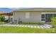 Backyard showing a patterned walkway, AC unit, exterior wall, and covered patio area at 3191 Marshfield Preserve Way, Kissimmee, FL 34746